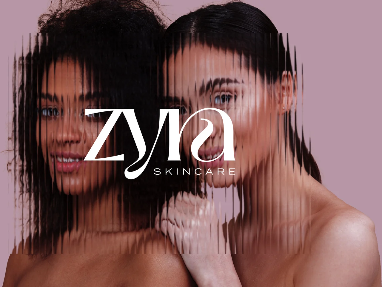 The Zyra Skincare wordmark set over a portrait of two models, on a mauve field